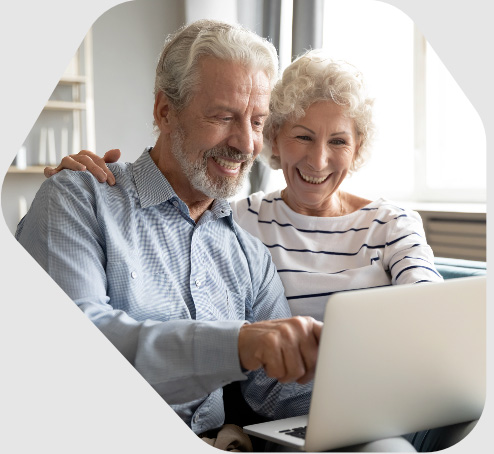 Couple pointing at computer